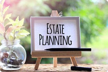 The image shows writing on the paper titled estate planning. - The Law Office of Rebecca Sommer